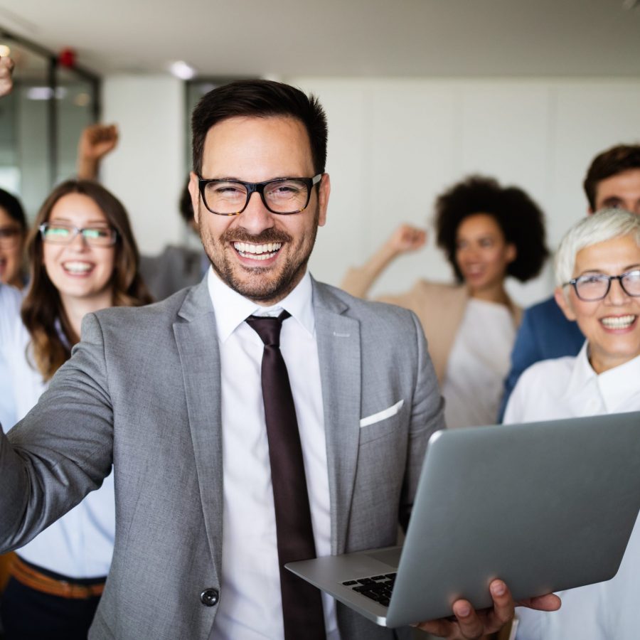 Business team celebrating a good job in the modern office